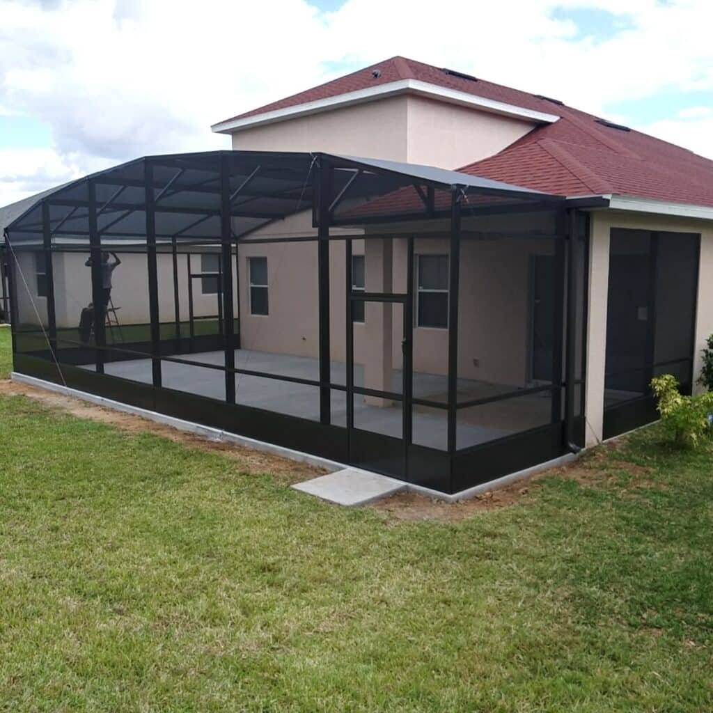 Patio enclosure installation in Panama City, FL on single-story residential home